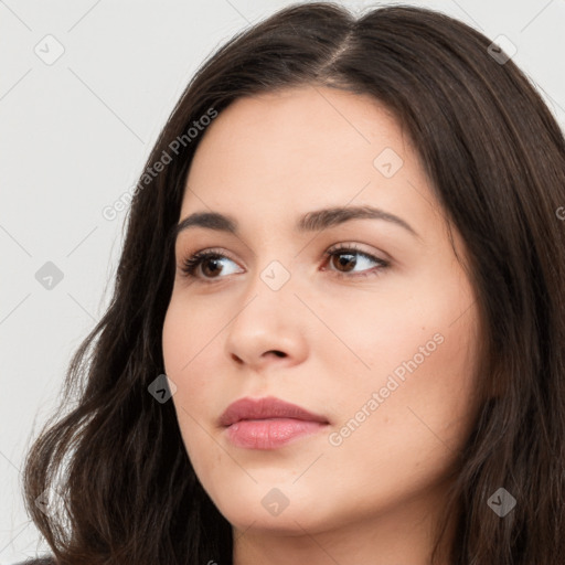 Neutral white young-adult female with long  brown hair and brown eyes