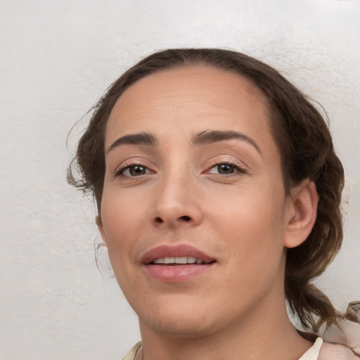 Joyful white young-adult female with medium  brown hair and brown eyes