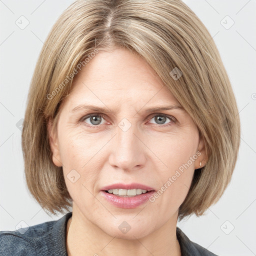 Joyful white adult female with medium  brown hair and grey eyes