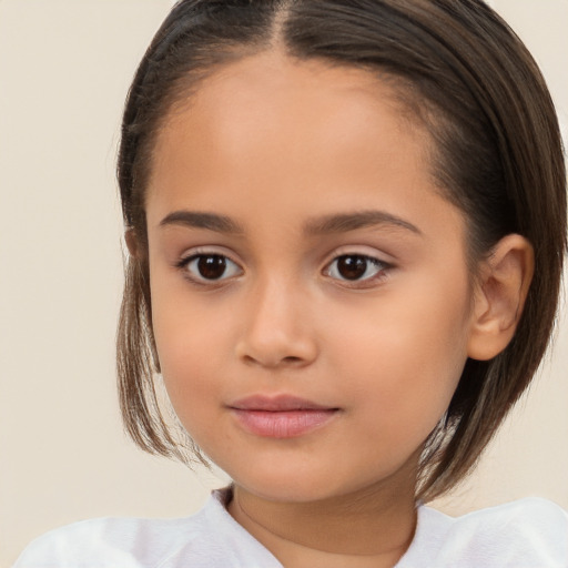 Joyful white child female with medium  brown hair and brown eyes