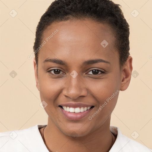 Joyful black young-adult female with short  brown hair and brown eyes