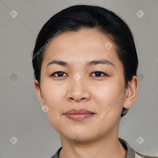 Joyful asian young-adult female with medium  black hair and brown eyes