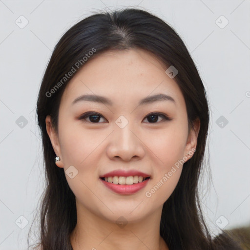 Joyful asian young-adult female with long  brown hair and brown eyes