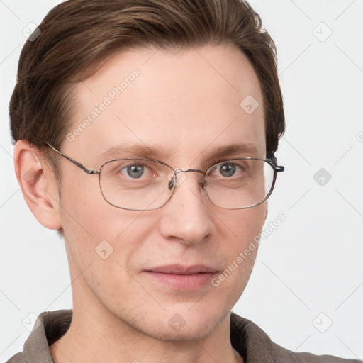 Joyful white adult male with short  brown hair and grey eyes