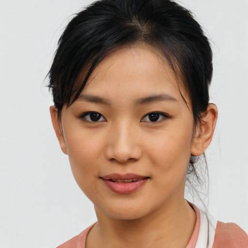 Joyful asian young-adult female with medium  brown hair and brown eyes