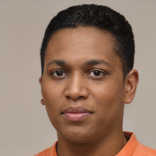 Joyful black young-adult male with short  black hair and brown eyes
