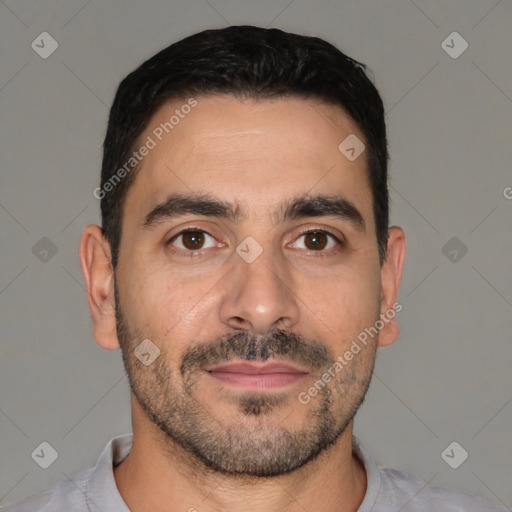 Joyful white young-adult male with short  black hair and brown eyes