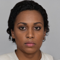 Neutral black young-adult female with short  brown hair and brown eyes