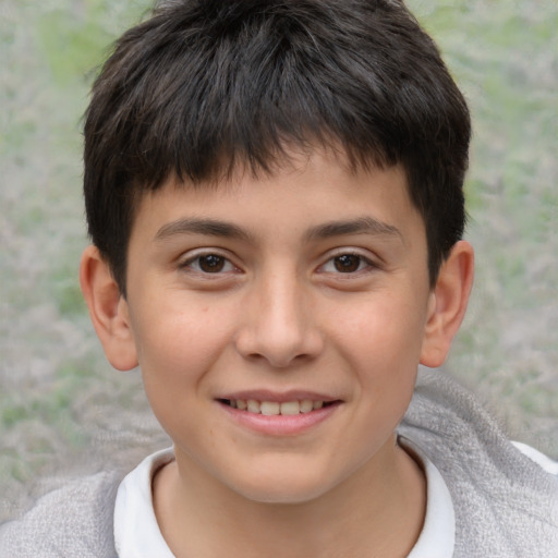 Joyful white child male with short  brown hair and brown eyes