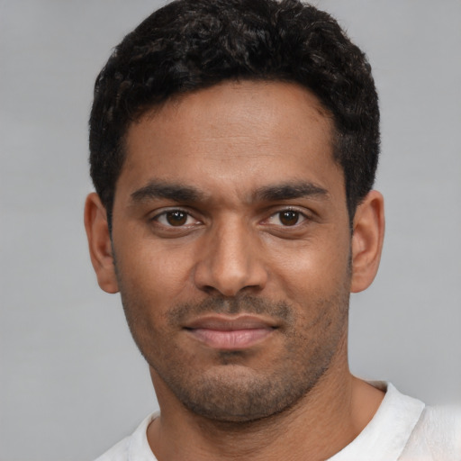 Neutral black young-adult male with short  black hair and brown eyes