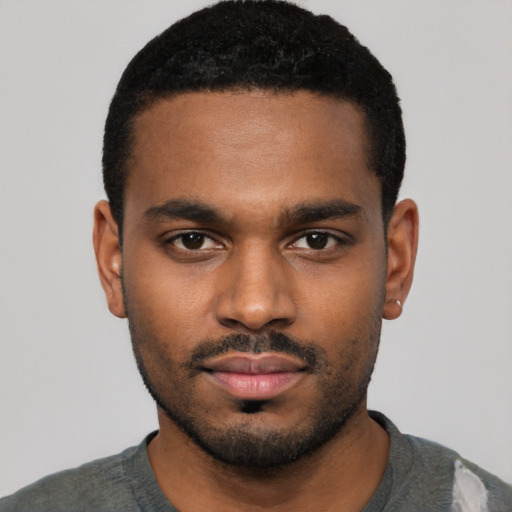 Neutral black young-adult male with short  black hair and brown eyes