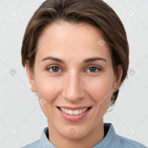 Joyful white young-adult female with short  brown hair and grey eyes