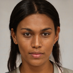 Neutral black young-adult female with medium  brown hair and brown eyes