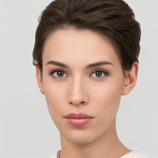 Neutral white young-adult female with short  brown hair and brown eyes