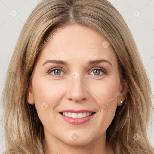 Joyful white young-adult female with long  brown hair and green eyes