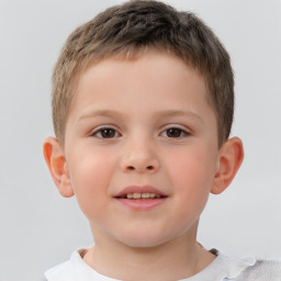 Joyful white child male with short  brown hair and brown eyes