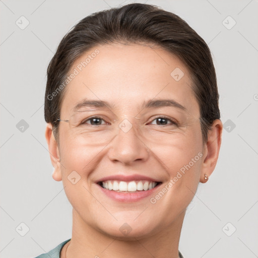 Joyful white adult female with short  brown hair and brown eyes