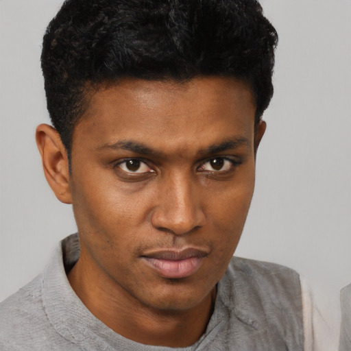 Neutral black young-adult male with short  black hair and brown eyes