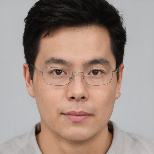 Neutral asian adult male with short  brown hair and brown eyes
