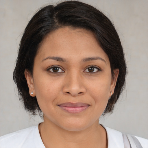 Joyful white young-adult female with medium  brown hair and brown eyes