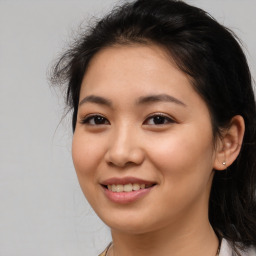 Joyful asian young-adult female with long  brown hair and brown eyes