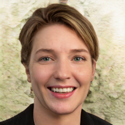 Joyful white young-adult female with short  brown hair and green eyes