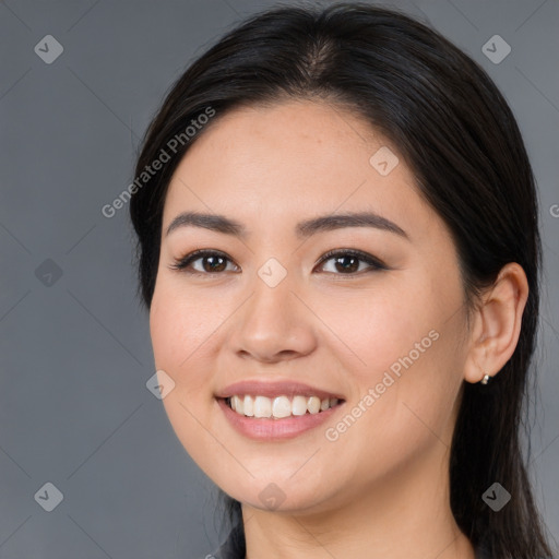 Joyful white young-adult female with long  brown hair and brown eyes