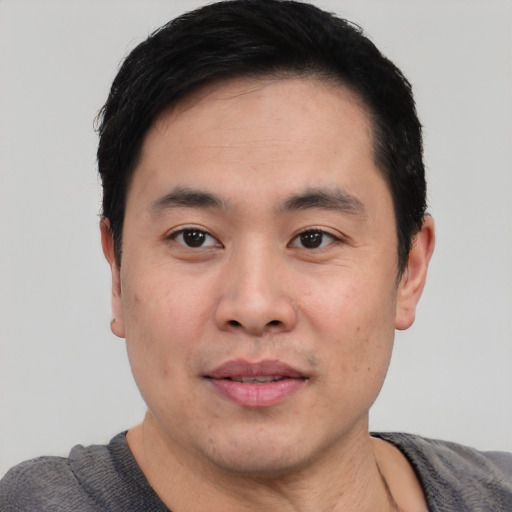Neutral asian young-adult male with short  black hair and brown eyes