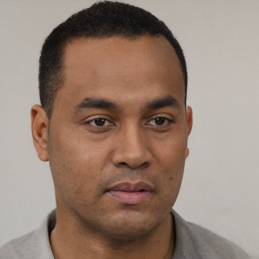 Neutral black young-adult male with short  black hair and brown eyes