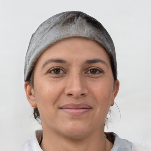 Joyful white young-adult female with short  black hair and brown eyes