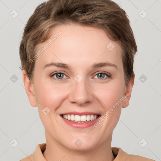 Joyful white young-adult female with short  brown hair and grey eyes