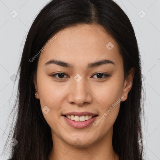 Joyful latino young-adult female with long  brown hair and brown eyes