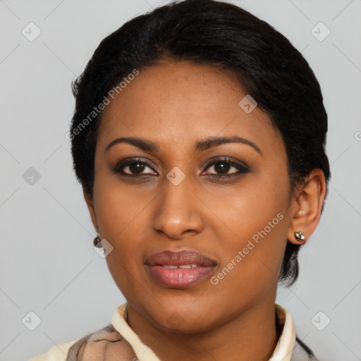 Joyful latino young-adult female with short  black hair and brown eyes