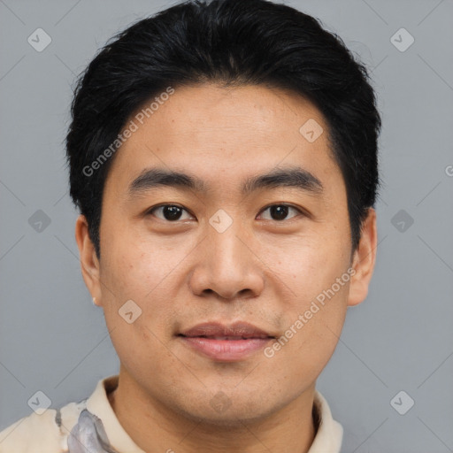 Joyful asian young-adult male with short  black hair and brown eyes