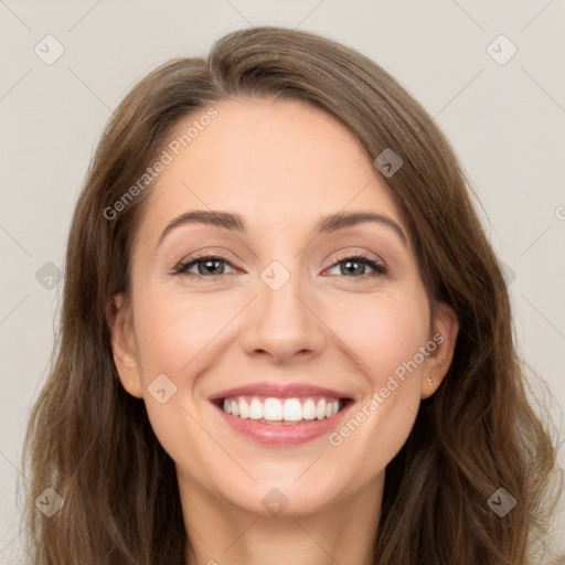 Joyful white young-adult female with long  brown hair and green eyes