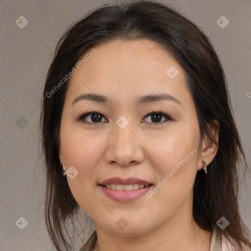 Joyful asian young-adult female with medium  brown hair and brown eyes