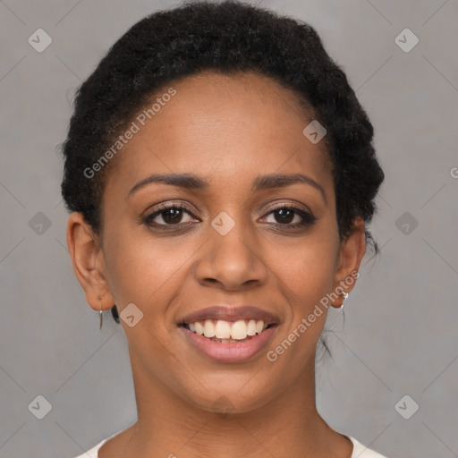 Joyful black young-adult female with short  brown hair and brown eyes