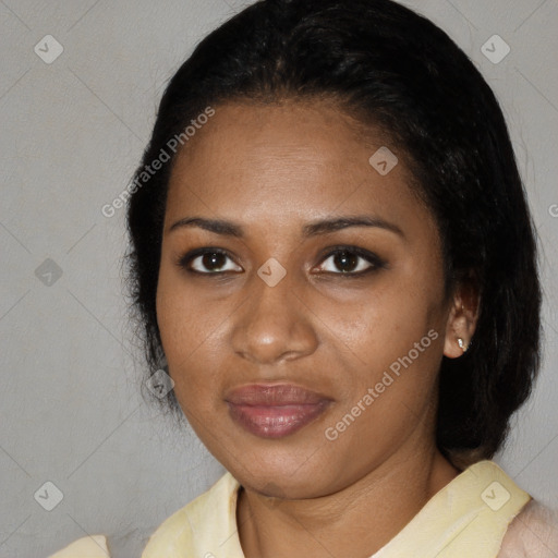 Joyful black young-adult female with medium  black hair and brown eyes