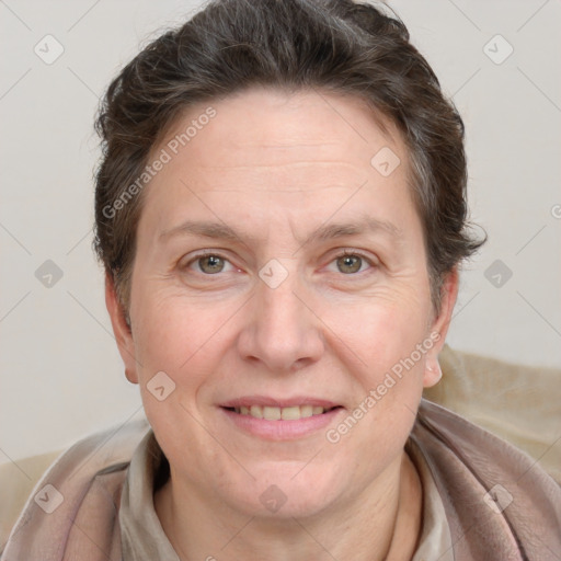 Joyful white adult female with medium  brown hair and grey eyes