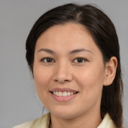 Joyful white adult female with medium  brown hair and brown eyes