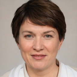 Joyful white adult female with medium  brown hair and brown eyes