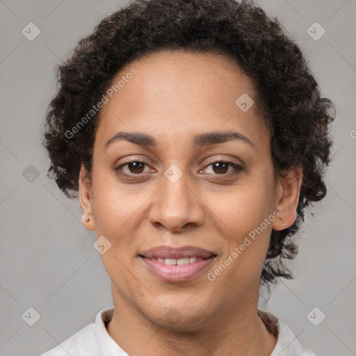 Joyful latino adult female with short  brown hair and brown eyes