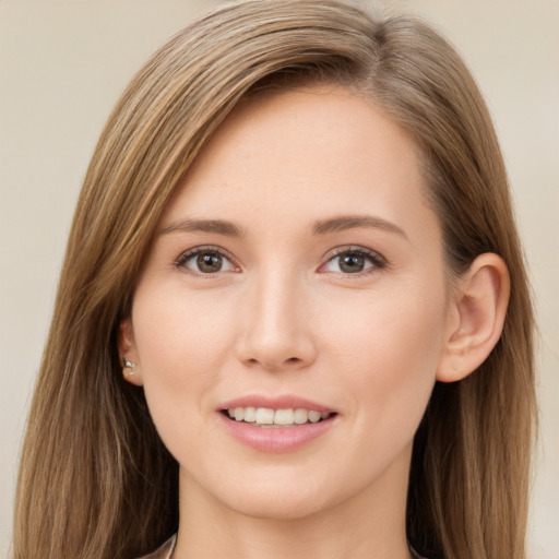 Joyful white young-adult female with long  brown hair and brown eyes