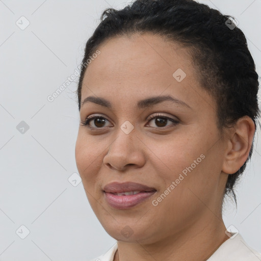 Joyful latino young-adult female with short  brown hair and brown eyes