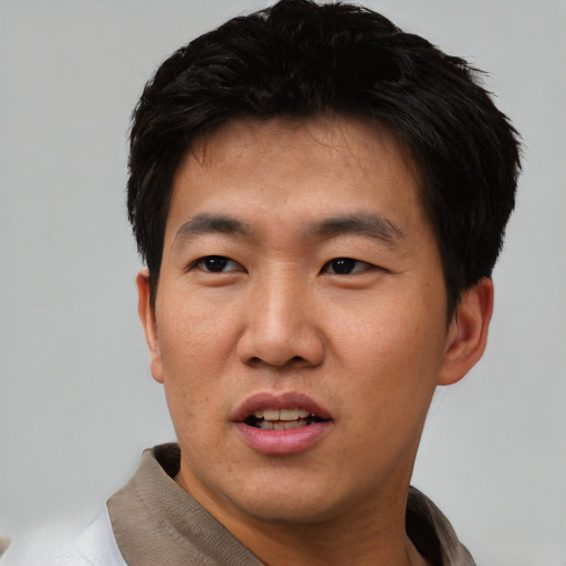 Neutral asian young-adult male with short  black hair and brown eyes
