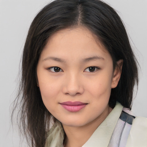 Joyful asian child female with medium  brown hair and brown eyes