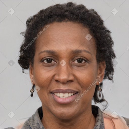 Joyful black adult female with short  brown hair and brown eyes