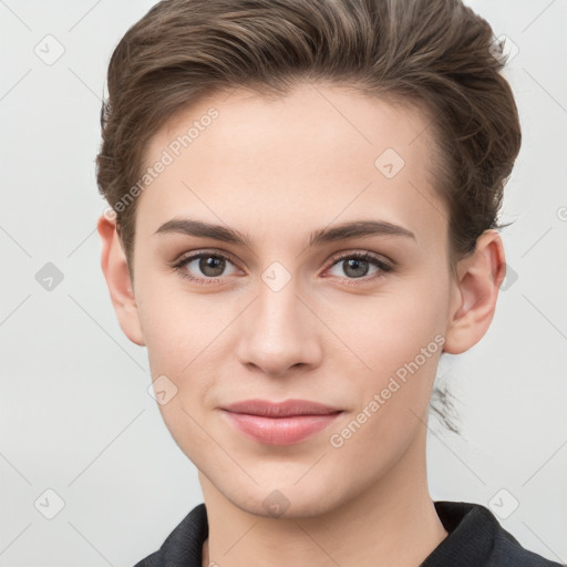 Joyful white young-adult female with short  brown hair and grey eyes