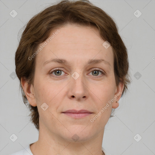 Joyful white adult female with short  brown hair and grey eyes