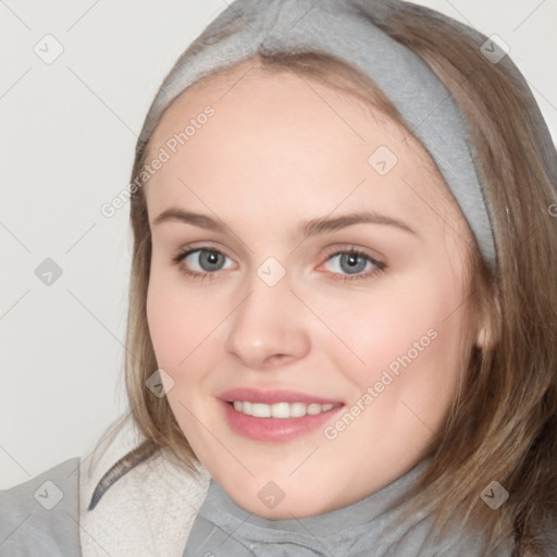 Joyful white young-adult female with medium  brown hair and blue eyes